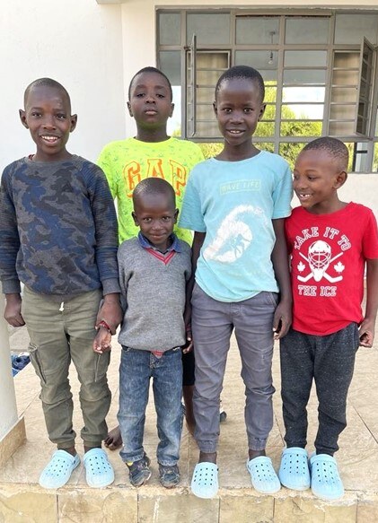 Four older boys welcome new little brother